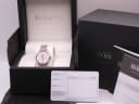 Michel Herbelin watch in its original black presentation box with papers and booklet, a dark outer box in the background.