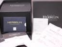 The original Michel Herbelin box contents, including the warranty card, instruction booklet, and the original purchase receipt dated 2015.