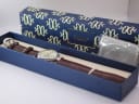 Stauer watch presented in its original dark blue branded box with a cleaning cloth, ready for gifting.