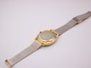 Angled rear view of the Tissot Seastar, showing the stainless steel case back and mesh bracelet.