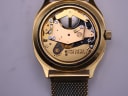 Open case back revealing the Tissot Calibre 2031 quartz movement and battery.