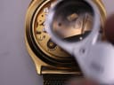Magnified view of the Tissot Calibre 2031 movement with 'Tissot' branding visible.