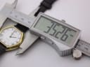 Digital caliper measuring the watch case, displaying a precise diameter of 35.26mm.