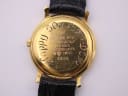 Close-up of the Raymond Weil 9920 gold PVD case back with "Happy 50m from 2/12" engraving and model number.
