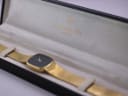 Raymond Weil watch nestled in its original black presentation box with gold branding.