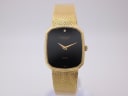 Full front view of the Raymond Weil watch with gold tonneau case and black dial on a white background.