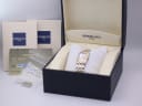 The original Raymond Weil presentation box and papers, including a warranty card and manual, alongside the watch and extra bracelet links.