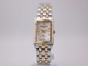 Front view of a two-tone Raymond Weil Tango ladies' watch with a rectangular case and cream mother-of-pearl dial.
