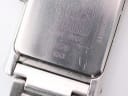Close-up of the watch case back, showing "Swiss Made", model 89746, and serial 6343 engravings.
