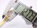 Digital caliper measuring the case width of the Orient watch, displaying 12.77mm.