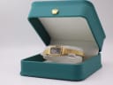The Orient watch presented in a generic green leatherette display box with a gold crown emblem.