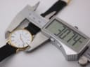 Digital caliper measuring the case diameter of the Mappin & Webb watch, displaying 30.74mm.