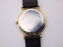 Direct back view of the Mappin & Webb watch, showing the stainless steel case back with serial number and the black leather strap.