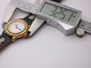 Digital caliper measuring the case diameter of the Michel Jordi watch, showing a precise reading of 32.51 mm.
