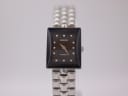Front view of the Rado Florence watch with black square dial and integrated steel bracelet.