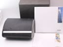 Top view of the opened and damaged original Rado watch box, with instruction manual and warranty papers.