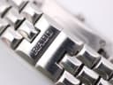 Close-up of the Rado signed deployant clasp on the integrated steel bracelet.