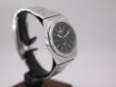 Another angled view of the Seiko 7223-6010, highlighting the brushed finish of the case and bracelet, with the black dial visible.