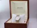 The Zenith Espada watch displayed inside its open original wooden presentation box with cream interior.