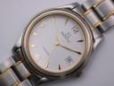Close-up front view of the Zenith Espada white dial, showing the Zenith logo, gold numerals, and date window.
