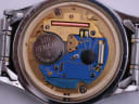 Close-up of the Zenith Swiss quartz movement, showing the Renata battery and internal components.