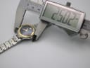 Digital caliper measuring the case diameter of the watch, displaying a reading of 25.02mm.