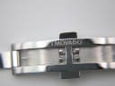 Close-up of the concealed butterfly clasp, revealing the "MOVADO" signature engraved on the inner side.