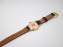 Rear view of the Michel Jordi watch showing the case back and the full length of the decorated leather strap.