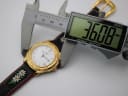 Digital caliper measuring the Michel Jordi watch case diameter at 36.08mm.