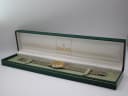 The Gucci 9000 M watch displayed inside its original green Gucci presentation box.