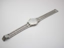 Full length bottom-up view of the Gucci 9000 M two-tone watch showing the case back and bracelet.