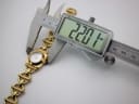 Digital caliper measuring the case diameter of the Gucci 6400 L, displaying a precise reading of 22.01mm.