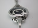 Low-angle perspective of the Gucci watch case and bracelet, showing its elegant lines.