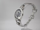 Angled side view of the Gucci 122.5 watch showing the polished steel case and bracelet design.