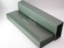 The original green Gucci watch presentation box and its matching outer sleeve.
