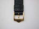 Close-up of the gold tone buckle, featuring the 'GG' Gucci logo.