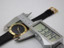 Digital caliper measuring the case diameter of the Gucci watch at 32.04mm.