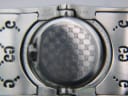 Close-up of the watch case back, showing engravings: 'WATER RESISTANT 3 ATM', '11247536', 'SWISS MADE', and model '112'.