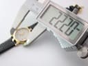 Digital caliper measuring the case diameter of the Gucci watch at 22.30mm.