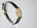 Opposite angled view of the Gucci 3400 L watch on a display stand, showing the subtle curve of the lugs and strap.