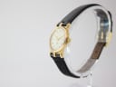 Angled view of the Gucci 3400 L watch on a display stand, highlighting the gold-tone case and the profile of the strap.