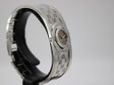 Side view of the Gucci 112 bangle watch displaying the crown and the integrated silver bracelet design.