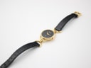 Top-down view of the entire Gucci 6000L watch on a white background, displaying the full strap and buckle.