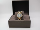 The Gucci 6000L watch presented in its open original brown Gucci box with a soft brown interior.