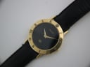 Close-up, slightly angled front view of the Gucci 3000 M dial, showing the Gucci logo, 'GG' emblem, and gold-tone hands.