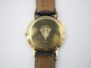 Detailed close-up of the gold-plated case back of the Gucci 3000 M, showing the Gucci crest, "3000 M" model, and serial number "0182944".