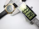Digital caliper measuring the case diameter of the Gucci 3000 M watch, displaying a reading of 33.74 mm.