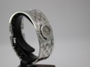 Another angled view of the Gucci 112 bangle watch, highlighting its sculptural form and polished finish.