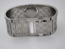 Interior view of the Gucci 112 bangle bracelet, showing the links and engraved GG pattern on the inner surface.