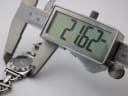 Digital caliper measuring the case diameter of the Gucci 6400 L, displaying a precise reading of 21.62 mm.